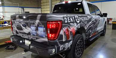 The truck's back showcases a vinyl decal.